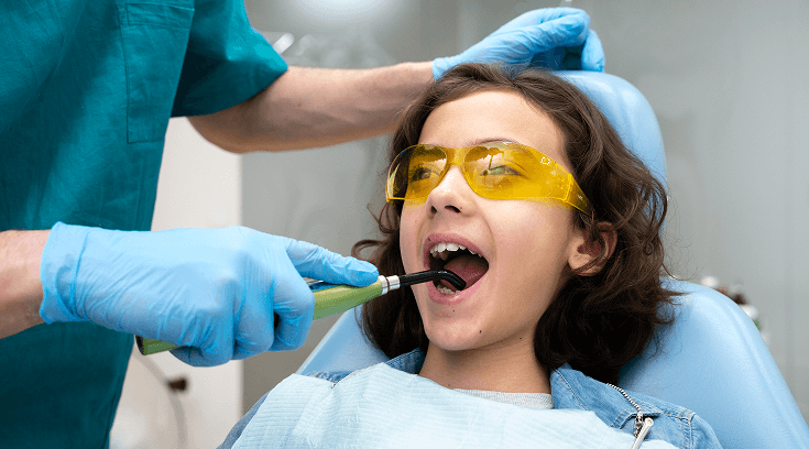 a dental treatment with a curing light